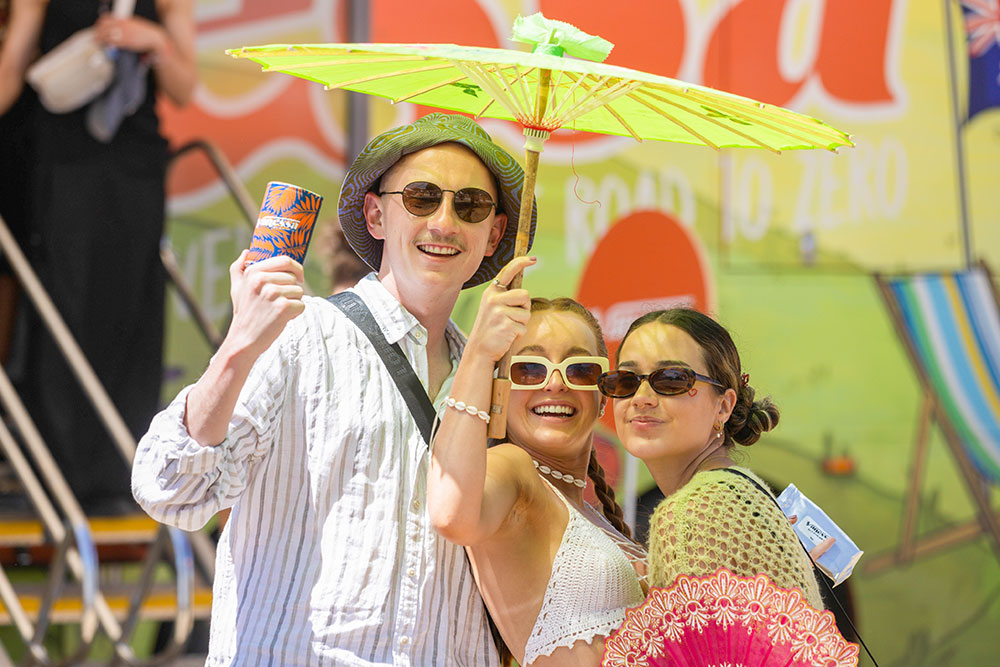 Festival goers under umbrella
